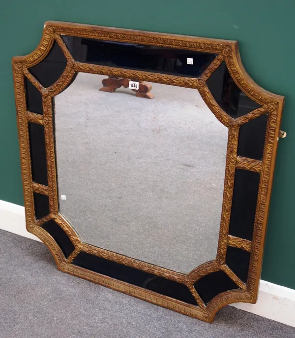 A 19th century Continental gilt framed wall mirror, with rounded re-entrant corners and blue glass marginal border, 93cm wide x 96cm high.