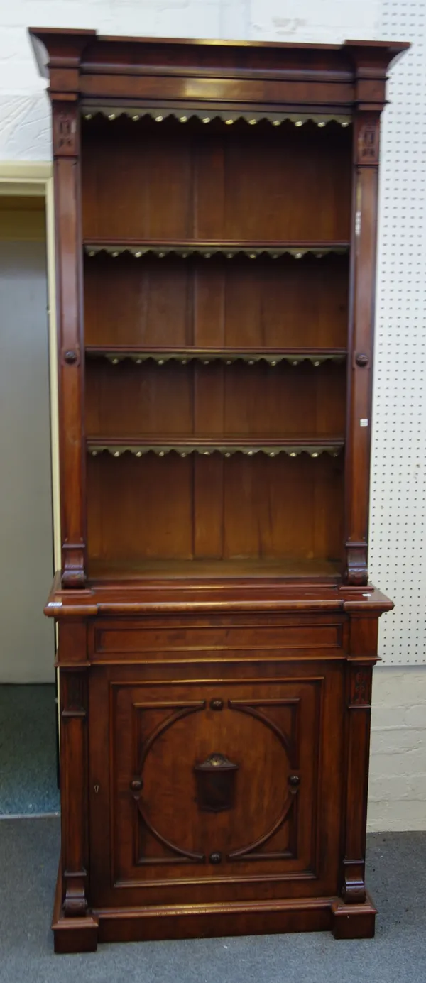 A Victorian mahogany bookcase cupboard, with three open shelves over single drawer and panelled cupboard, on plinth base, 86cm wide x 223cm high x 44c