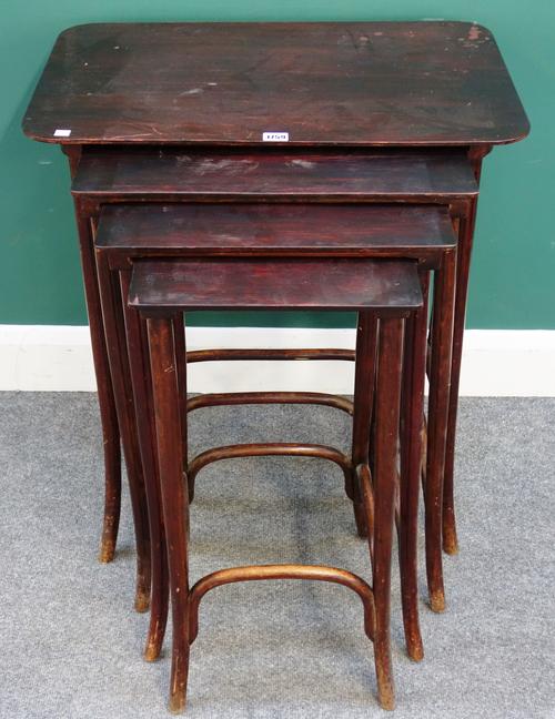 Probably Thonet; a nest of four early 20th century beech bentwood occasional tables, the largest 65cm wide x 75cm high x 42cm deep.