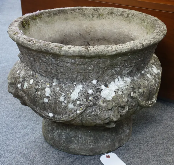 A reconstituted stone jardiniere with shallow lobed bowl and fluted socle, on stepped square base, 80cm wide x 123cm high.