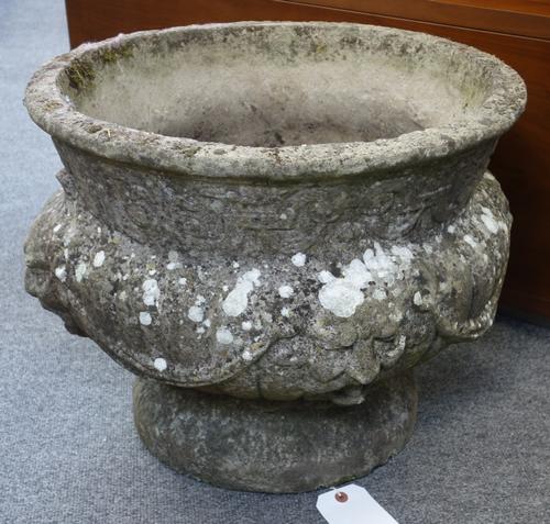 A reconstituted stone jardiniere with shallow lobed bowl and fluted socle, on stepped square base, 80cm wide x 123cm high.