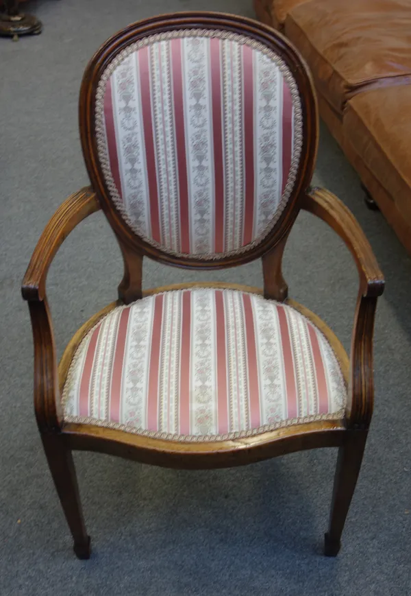 A set of ten late 19th century Louis XVI style oval back open armchairs, on tapering square supports, 56cm wide x 95cm high x 50cm deep, (10).