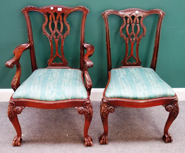A set of eight Chippendale Revival style mahogany framed dining chairs, with interlaced pierced splat, and claw and ball feet, to include a pair of ca