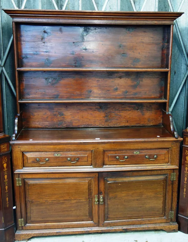 An 18th century and later oak dresser, the enclosed two tier plate rack over pair of drawers and cupboards, 146cm wide x 189cm high x 44cm deep.