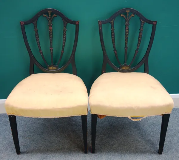 A pair of 19th century floral painted ebonised shield back side chairs, each with bow seat on tapering square supports, 57cm wide x 95cm high x 50cm d