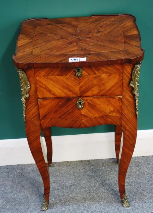 An 18th century French gilt bronze mounted Kingwood side table, the shaped top over a pair of frieze drawers on slender cabriole supports, 40cm wide x