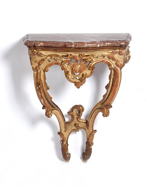A small 18th century pier table, the serpentine marble top on a parcel gilt cream painted base with opposing 'C' scroll supports, 52cm wide x 107cm hi