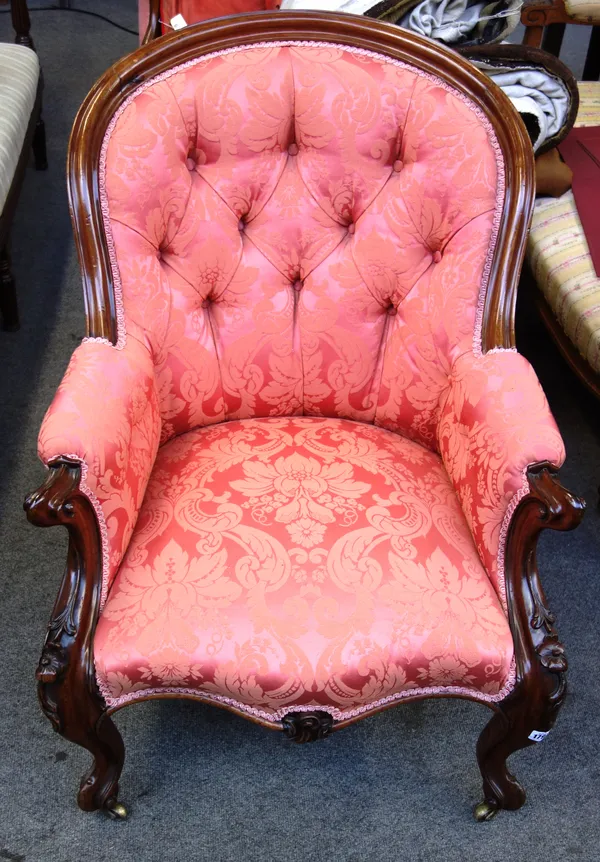 A mid-Victorian mahogany framed tub back easy armchair, with serpentine seat on scroll supports, 70cm wide x 89cm high x 79cm deep.