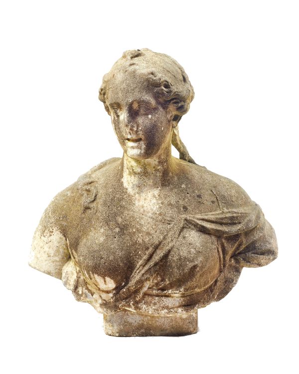 An 18th century weathered carved white marble portrait bust of a woman wearing classical draped clothing, on an integral socle base, 56cm wide x 64cm