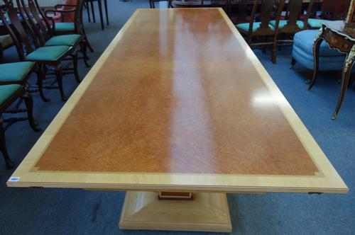 Glyn Peter Machin; a 20th century maple and burr wood inlaid rectangular extending dining table on a pair of 'U' supports, two extra leaves, 115cm wid