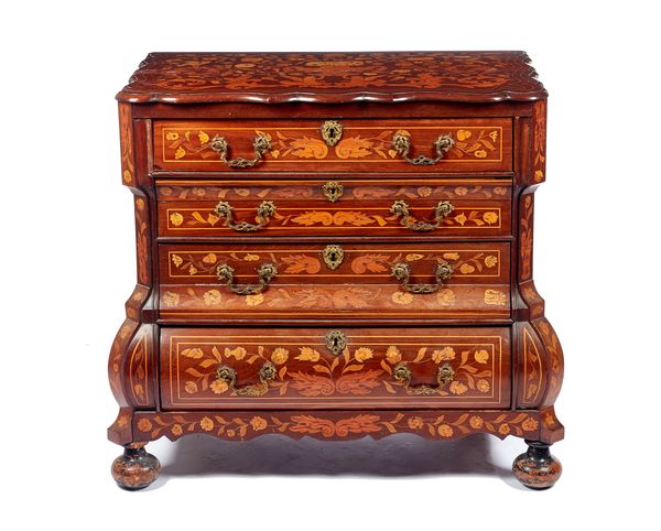 A late 18th century Dutch floral marquetry inlaid chest, the shaped top over a bombe base of four long graduated drawers, on bun feet, 91cm wide x 81c