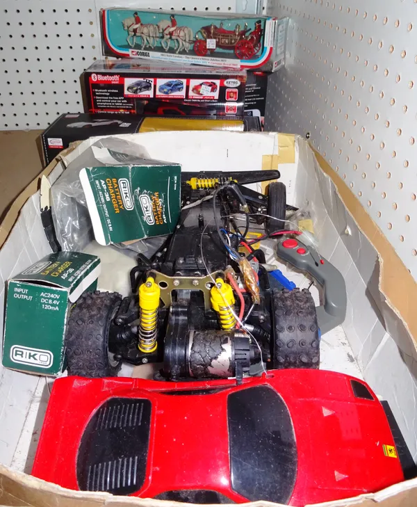 Toys, comprising; a quantity of 20th century remote controlled cars and accessories, (a.f). S3