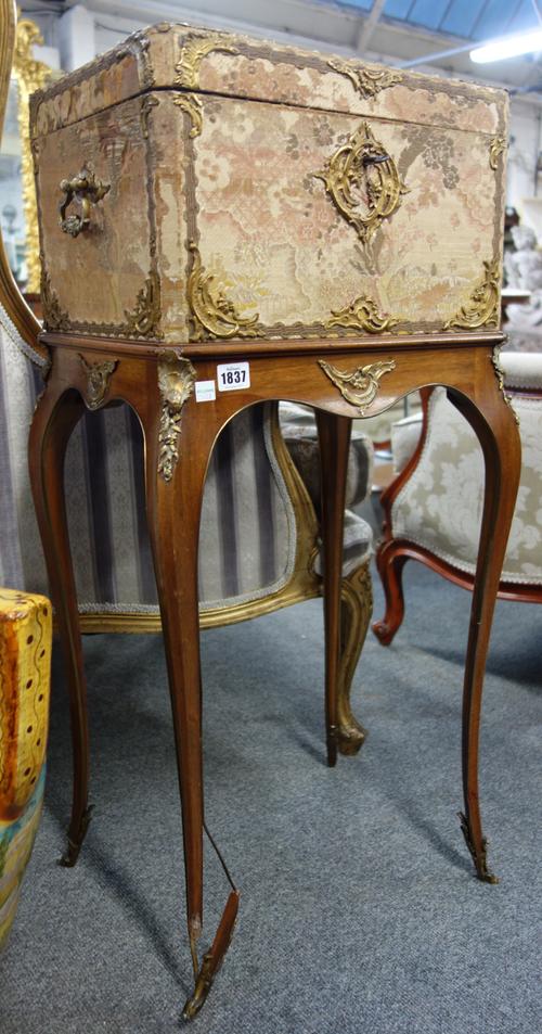 A 19th century French gilt metal mounted silk veneered rectangular box, on four slender mahogany supports, 45cm wide x 91cm high x 34cm deep.