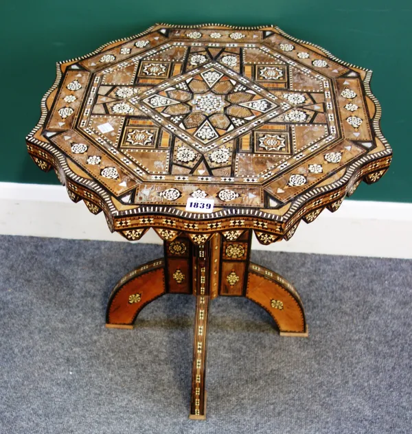 A 20th century Syrian bone, mother-of-pearl and specimen wood inlaid octagonal occasional table, on four downswept supports, 52cm wide x 53cm high.