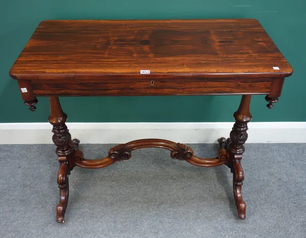 A Victorian rosewood rectangular single drawer centre table, with shaped stretcher, 97cm wide x 78cm high x 51cm deep.