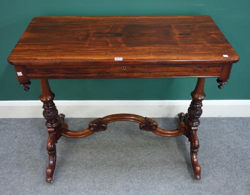 A Victorian rosewood rectangular single drawer centre table, with shaped stretcher, 97cm wide x 78cm high x 51cm deep.