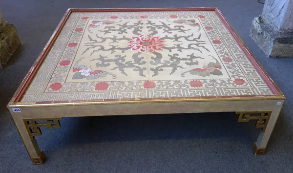 A large 20th century square coffee table, the inset silk panel on parcel gilt painted block supports with pierced corner brackets, 128cm wide x 41cm h