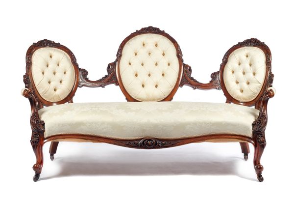 A Victorian triple chair back sofa with carved mahogany show frame and serpentine seat, on scroll supports, 172cm wide x 94cm high x 85cm deep.  Illus
