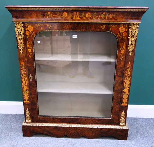 A Victorian marquetry inlaid gilt metal mounted walnut pier cabinet, with single glazed door and shaped plinth base, 99cm wide x 110cm high x 36cm dee