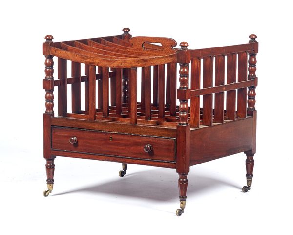 A George III mahogany Canterbury, with a concave six division top over single frieze drawer on turned supports, 52cm wide x 52cm high x 48cm deep.  Il