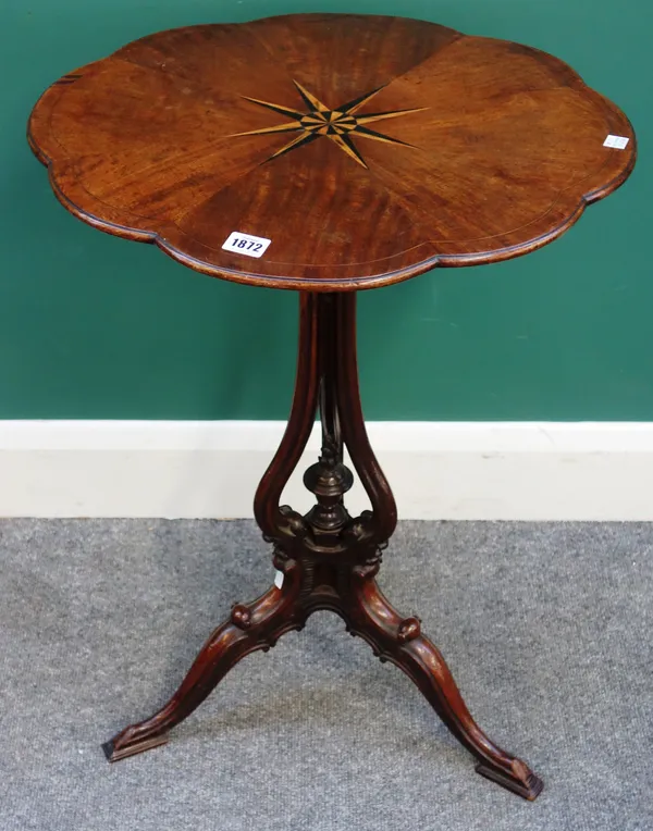 A late Victorian inlaid mahogany occasional table of 18th century design, the shaped oval top on an open baluster column and three downswept supports,