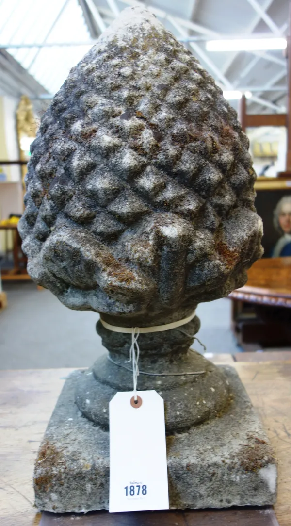 A pair of reconstituted stone pineapple gate pier finials on square bases, 30cm wide x 55cm high, (2).