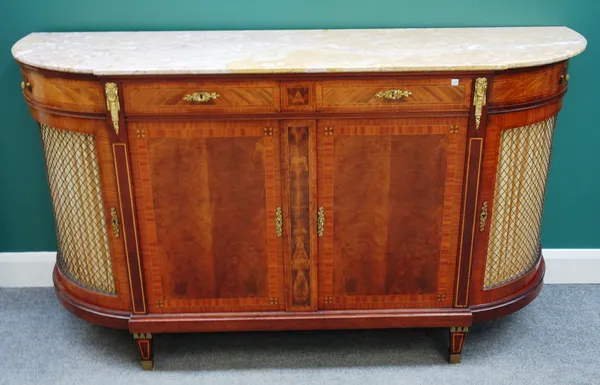 A late 19th century French sideboard, the breakfront 'D' shaped top over a gilt metal mounted satinwood banded mahogany base of four drawers over pair