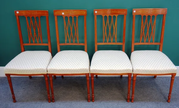 A set of four Edwardian inlaid satinwood side chairs, each with lattice back and straight front seat, on tapering turned supports, 42cm wide x 92cm hi