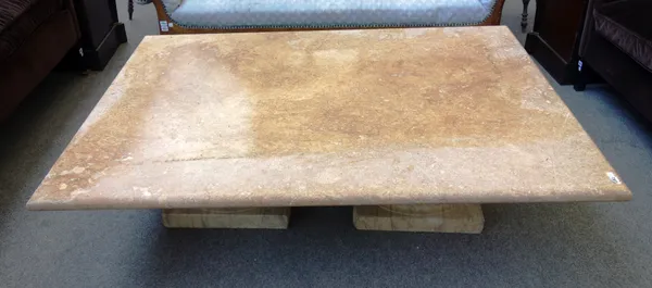A rectangular marble coffee table, raised on a pair of Ionic capitals, 110cm deep x 150cm wide.