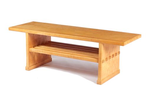 Attributed to Alan Peters; a 20th century figured ash coffee table, the rectangular one piece top on a pair of slab end supports, united by slatted un