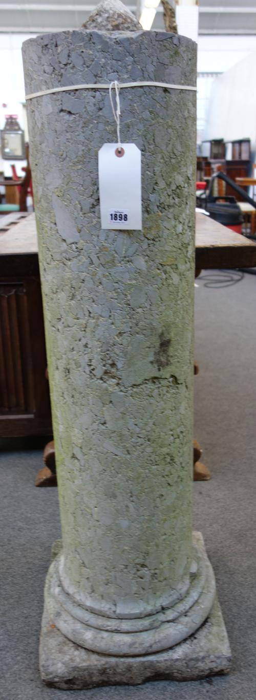 A reformed stone circular column on stepped base, 37cm wide x 113cm high.