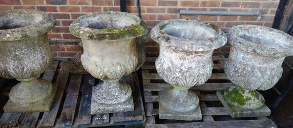 A set of five reconstituted stone jardinieres, with leaf moulded bodies and turned socle on square base, 56cm wide x 70cm high, (5).