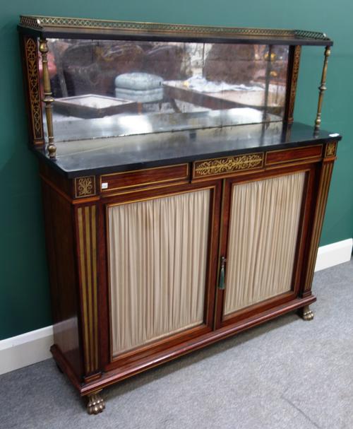 A Regency brass inlaid rosewood chiffonier, the brass galleried ledge back above mirror plate and marble top, over a glazed two door base, on gilt paw