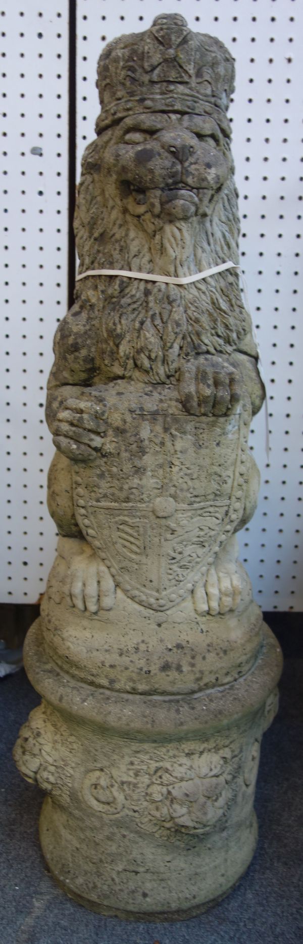 A pair of reconstituted stone figures of sejeant lions, on circular bases, 103cm high, (2).