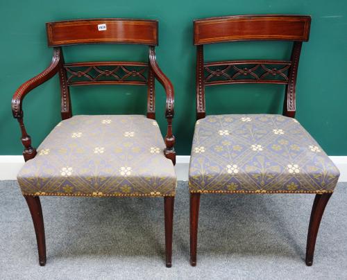 A set of eight Regency mahogany dining chairs with interlaced 'X' frame splat back on sabre supports, to include a pair of carvers, (8).