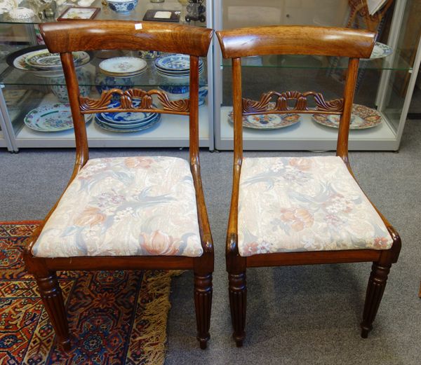 A set of eight William IV rosewood dining chairs, with carved waist rail on tapering reeded supports, 85cm high x 47cm wide x 52cm deep, (8).