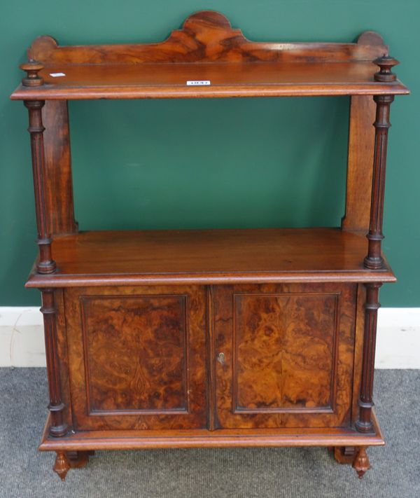 A Victorian figured walnut hanging cupboard, with two open tiers above cupboards, flanked by fluted supports, 53cm wide x 77cm high x 21cm deep.