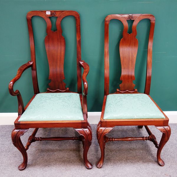 A set of twelve George I style mahogany dining chairs with pierced splat back and straight front seat, on pad feet united by turned stretcher, to incl