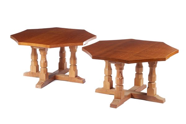 Robert 'Mouseman' Thompson of Kilburn; a pair of 20th century oak side tables, each with adzed octagonal top, on four baluster supports united by stre