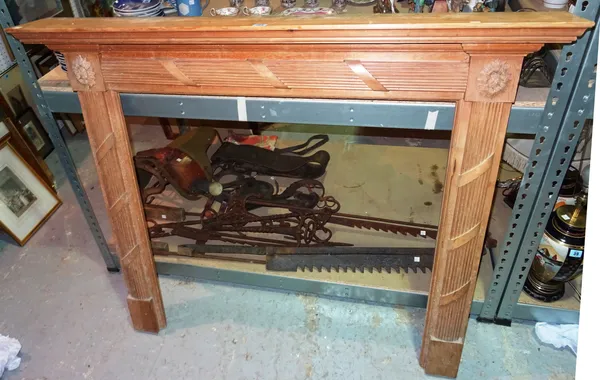 A 20th century pine fire surround, a quantity of metalware, a boot scraper and a horse saddle, (qty). S2