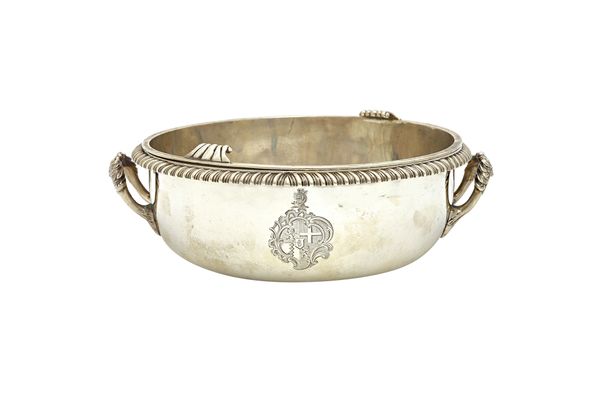 A George III silver souffle dish, with a drop in liner, the twin handled circular dish with a bold gadrooned rim, engraved with the coat of arms and c