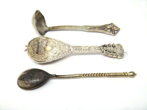 A Russian teaspoon, the back of the bowl niello decorated with a view of a church, the stem with spiral decoration, probably Moscow 1895, length 13.5c