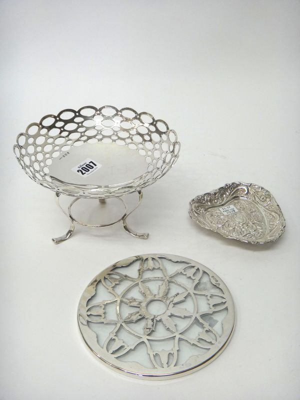 Silver and silver mounted wares, comprising; a shaped circular large bon bon dish, decorated with a wide border of oval piercings and raised on a trif