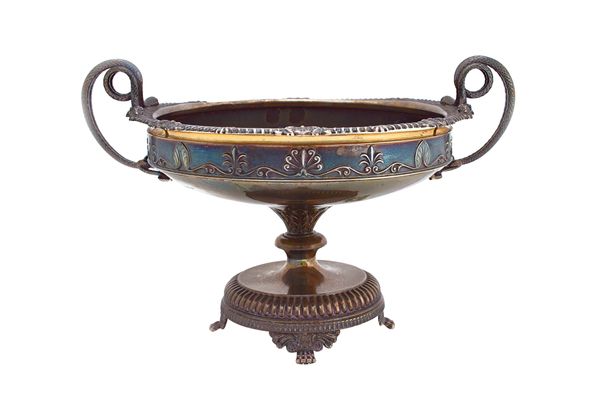 A silver twin handled table centrepiece tazza, of shaped circular form, having serpentine handles, in the Greek Revival style, raised on a partly flut