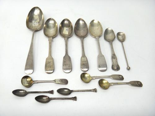 A group of silver spoons, comprising; an Old English pattern table spoon, Exeter possibly 1798, four fiddle pattern dessert spoons, a pair of fiddle a