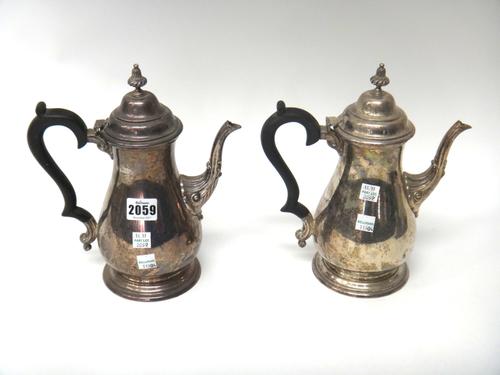 An Indian Sterling silver two piece cafe au lait set, in the 18th century taste, each piece of baluster form with fluted decoration to the spout, spir