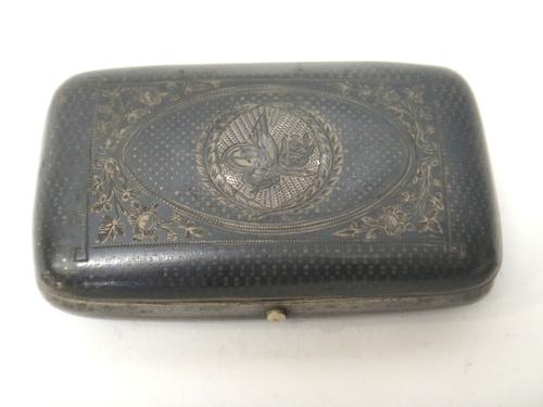 An Eastern niello decorated curved rectangular hinge lidded case, the centre of the lid decorated with an Eastern monogram, possibly Turkish, within a