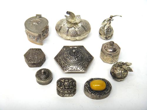 An Egyptian hexagonal hinge lidded pill box, decorated with Ancient Egyptian hieroglyphs, a cut cornered rectangular pill box detailed '800' and eight