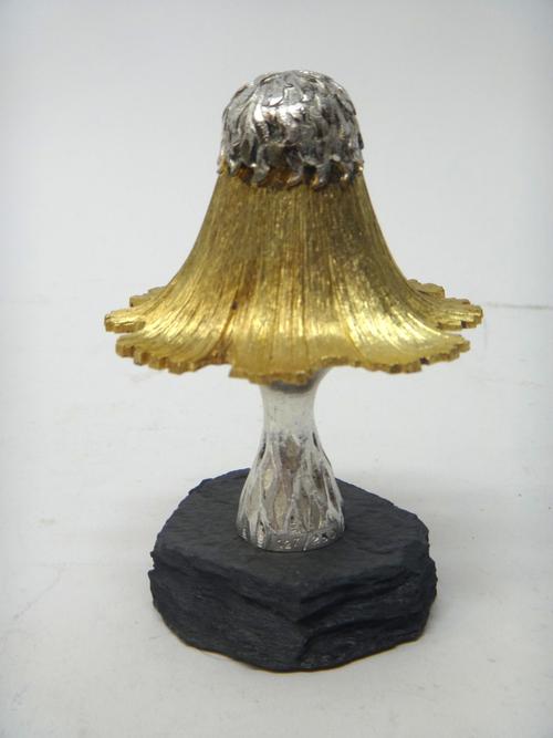 A silver and silver gilt limited edition ornamental mushroom, blue stone egg carvers theme, raised on a slate base, London 1980, maker C.N. Lawrence,