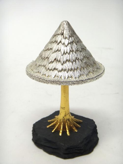 A silver and silver gilt limited edition ornamental mushroom, Christmas theme, raised on a slate base, London 1983, maker C.N. Lawrence, height 13cm.